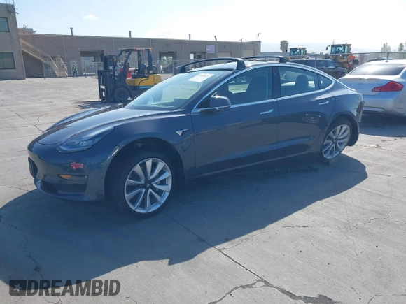 2018 Tesla Model 3 Long Range Battery with VIN 5YJ3E1EA4JF024102, listed as a IAAI auction lot 42100621 with 86,298 mi miles and . Bid and sale history available at DreamBid. Image 19.