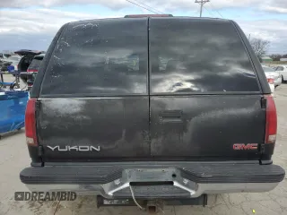 1999 GMC Yukon with VIN 1GKEK13R9XJ803351, listed as a Copart auction lot 81800974 with 0 mi miles and Salvage Title. Bid and sale history available at carsss.com. Image 6.