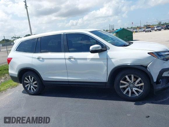 2020 Honda Pilot EX-L with VIN 5FNYF5H59LB028268, listed as a IAAI auction lot 42355620 with 107,033 mi miles and . Bid and sale history available at DreamBid. Image 13.