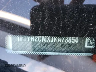 2018 Ford Transit z VIN 1FTYR2CMXJKA73854, wystawiony jako Copart lot #81051414 z przebiegiem Nie podano mil oraz Szkody całkowita. Historia ofert i sprzedaży dostępna na DreamBid. Obrazek 13.