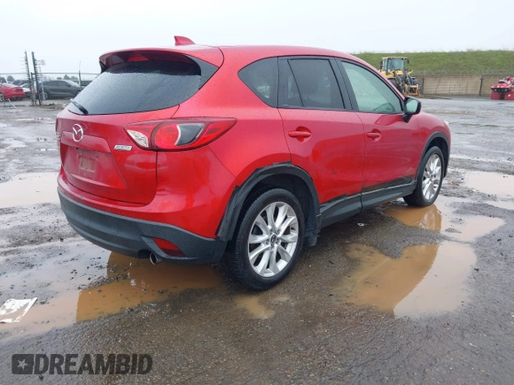 2015 Mazda CX-5 Grand Touring with VIN JM3KE4DY6F0501072, listed as a IAAI auction lot 41534176 with 90,160 mi miles. Bid and sale history available at carsss.com. Image 4.