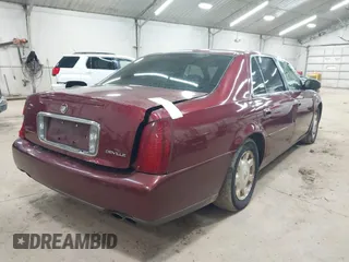2002 Cadillac DeVille with VIN 1G6KD54Y12U214732, listed as a IAAI auction lot 42018412 with 139,474 mi miles. Bid and sale history available at carsss.com. Image 4.