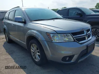 2015 Dodge Journey SXT z VIN 3C4PDCBG0FT591439, wystawiony jako IAAI lot #42645467 z przebiegiem 216 813 mil mil oraz . Historia ofert i sprzedaży dostępna na DreamBid. Obrazek 1.
