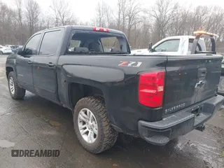 2018 Chevrolet Silverado 1500 LT with VIN 3GCUKREC5JG460979, listed as a IAAI auction lot 41741667 with 122,931 mi miles. Bid and sale history available at carsss.com. Image 3.