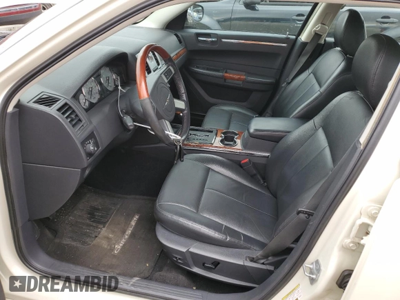 2009 Chrysler 300 Limited with VIN 2C3KA33V39H590917, listed as a Copart auction lot 77657054 with 180,613 mi miles and Clean Title. Bid and sale history available at carsss.com. Image 7.