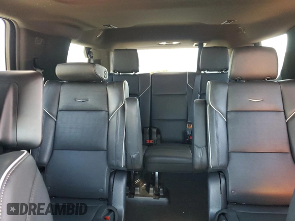 2023 Cadillac Escalade RWD Premium Luxury z VIN 1GYS3BKL4PR395559, wystawiony jako Copart lot #48347285 z przebiegiem 3 818 mil mil oraz Szkoda całkowita • Salvage title. Historia ofert i sprzedaży dostępna na DreamBid. Obrazek 10.