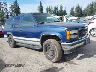 1997 GMC Yukon with VIN 1GKEK13R8VJ737324, listed as a IAAI auction lot 41675479 with 237,223 mi miles. Bid and sale history available at carsss.com. Image 1.