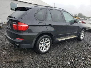 2012 BMW X5 35i with VIN 5UXZV4C57CL765053, listed as a Copart auction lot 59997275 with 157,943 mi miles and Salvage title. Bid and sale history available at DreamBid. Image 3.