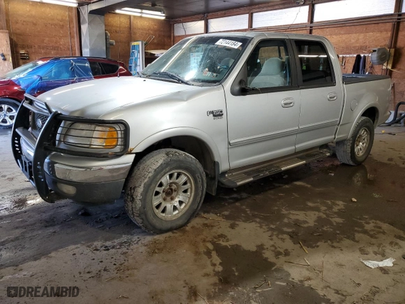 2001 Ford F-150 SuperCrew XLT with VIN 1FTRW08L41KD94810, listed as a Copart auction lot 72144184 with 191,313 mi miles and Salvage Title. Bid and sale history available at carsss.com. Image 1.
