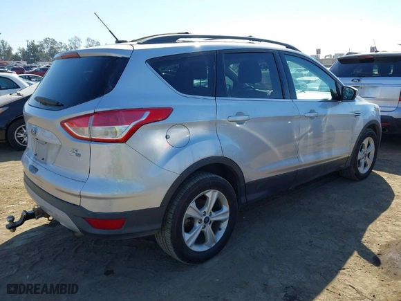 2015 Ford Escape SE with VIN 1FMCU9G99FUA44456, listed as a IAAI auction lot 40526412 with 94,998 mi miles. Bid and sale history available at carsss.com. Image 4.