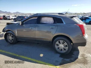 2014 Cadillac SRX z VIN 3GYFNAE37ES609830, wystawiony jako Copart lot #51542955 z przebiegiem 122 560 mil mil oraz Szkody całkowita. Historia ofert i sprzedaży dostępna na DreamBid. Obrazek 2.