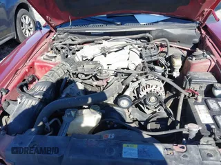 2004 Ford Mustang Deluxe with VIN 1FAFP44694F219365, listed as a IAAI auction lot 41628448 with 124,733 mi miles. Bid and sale history available at carsss.com. Image 10.