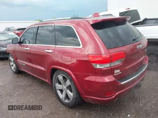 2014 Jeep Grand Cherokee Overland with VIN 1C4RJFCG9EC460165, listed as a IAAI auction lot 42092137 with 131,802 mi miles and . Bid and sale history available at DreamBid. Image 3.