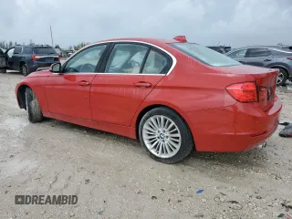 2014 BMW 3 Series 328i xDrive with VIN WBA3B3C59EJ977670, listed as a Copart auction lot 61997165 with 128,937 mi miles and Salvage title. Bid and sale history available at DreamBid. Image 2.