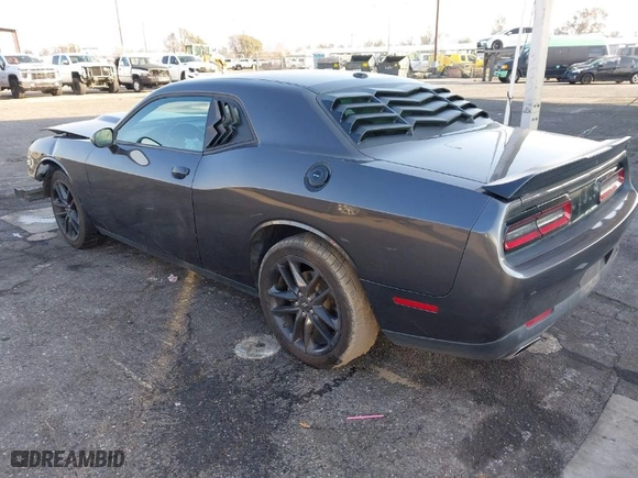 2021 Dodge Challenger GT with VIN 2C3CDZKG4MH677574, listed as a IAAI auction lot 41460036 with 67,170 mi miles. Bid and sale history available at carsss.com. Image 3.