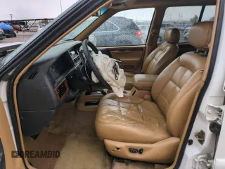 1996 Jeep Grand Cherokee Limited with VIN 1J4GZ78Y0TC185669, listed as a Copart auction lot 79032274 with 184,929 mi miles and Salvage Title. Bid and sale history available at carsss.com. Image 7.