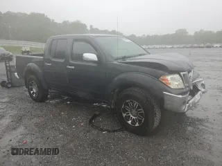 2010 Nissan Frontier SE with VIN 1N6AD0EV5AC407533, listed as a Copart auction lot 52020365 with 119,041 mi miles and Salvage title. Bid and sale history available at DreamBid. Image 4.