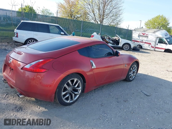 2014 Nissan 370Z Nismo with VIN JN1AZ4EH9EM636340, listed as a IAAI auction lot 42112548 with 143,894 mi miles and . Bid and sale history available at DreamBid. Image 4.