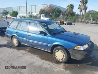 1991 Toyota Corolla z VIN JT2AE94K2M3432818, wystawiony jako IAAI lot #42094313 z przebiegiem 204 279 mil mil oraz . Historia ofert i sprzedaży dostępna na DreamBid. Obrazek 1.