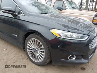 2013 Ford Fusion Titanium Hybrid with VIN 3FA6P0RU2DR281905, listed as a IAAI auction lot 41765130 with 119,348 mi miles. Bid and sale history available at carsss.com. Image 6.