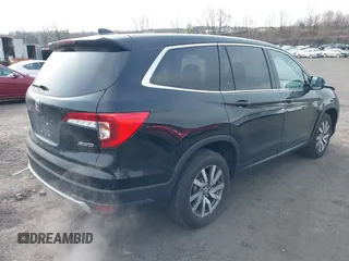 2021 Honda Pilot EX-L with VIN 5FNYF6H56MB099919, listed as a IAAI auction lot 42000420 with 28,877 mi miles and . Bid and sale history available at carsss.com. Image 4.