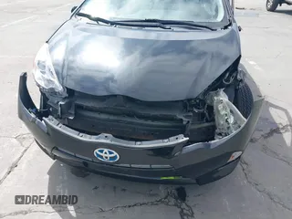 2014 Toyota Prius One z VIN JTDKDTB33E1569335, wystawiony jako IAAI lot #42483772 z przebiegiem Nie podano mil oraz . Historia ofert i sprzedaży dostępna na DreamBid. Obrazek 16.