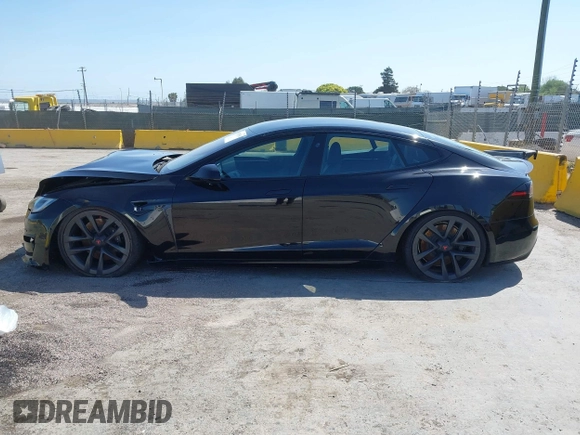 2022 Tesla Model S Plaid with VIN 5YJSA1E61NF483354, listed as a IAAI auction lot 41973636 with 32,541 mi miles and . Bid and sale history available at DreamBid. Image 14.