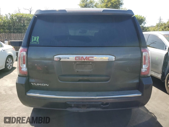 2015 GMC Yukon Denali with VIN 1GKS2CKJ8FR596848, listed as a Copart auction lot 52048105 with 129,935 mi miles and Salvage Title. Bid and sale history available at carsss.com. Image 6.