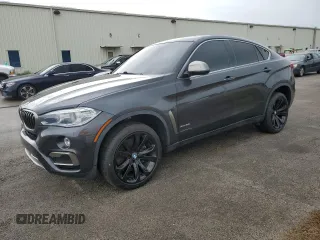 2018 BMW X6 xDrive50i with VIN 5UXKU6C5XJ0W39056, listed as a Copart auction lot 75116634 with 90,043 mi miles and Salvage Title. Bid and sale history available at carsss.com. Image 1.