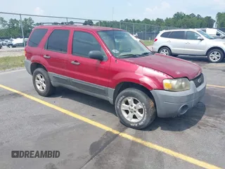 2006 Ford Escape XLT with VIN 1FMYU03136KD09448, listed as a IAAI auction lot 42578120 with 235,521 mi miles and . Bid and sale history available at DreamBid. Image 1.
