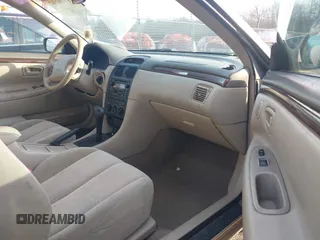 2000 Toyota Solara SE with VIN 2T1CG22P7YC303938, listed as a IAAI auction lot 41770102 with 163,137 mi miles. Bid and sale history available at carsss.com. Image 5.
