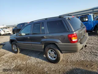 2002 Jeep Grand Cherokee Laredo with VIN 1J4GW48N32C180185, listed as a Copart auction lot 51988335 with 212,399 mi miles and Salvage Title. Bid and sale history available at carsss.com. Image 2.