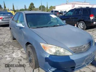 2004 Toyota Camry LE with VIN 4T1BF32K94U576056, listed as a IAAI auction lot 41721057 with 259,906 mi miles. Bid and sale history available at carsss.com. Image 1.