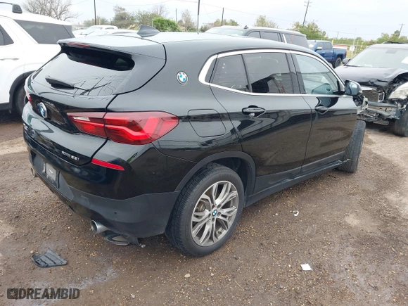 2022 BMW X2 xDrive28i with VIN WBXYJ1C01N5U20171, listed as a IAAI auction lot 41284932 with 64,256 mi miles. Bid and sale history available at carsss.com. Image 4.
