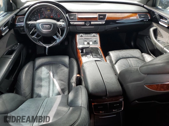 2014 Audi A8 3.0T z VIN WAURGAFD2EN002567, wystawiony jako Copart lot #48188395 z przebiegiem 159 477 mil mil oraz Szkody całkowita. Historia ofert i sprzedaży dostępna na DreamBid. Obrazek 8.