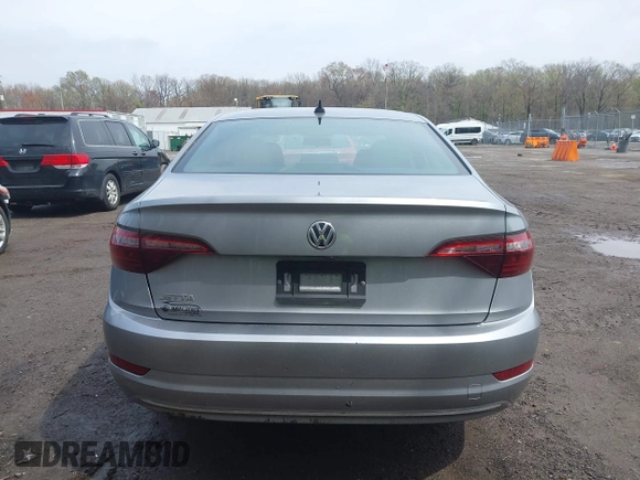 2021 Volkswagen Jetta S z VIN 3VWC57BUXMM048600, wystawiony jako IAAI lot #41956222 z przebiegiem 59 870 mil mil oraz . Historia ofert i sprzedaży dostępna na DreamBid. Obrazek 16.