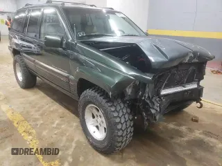 1995 Jeep Grand Cherokee Limited z VIN 1J4GZ78S7SC766726, wystawiony jako Copart lot #84909134 z przebiegiem 174 256 mil mil oraz Szkoda całkowita • Salvage title. Historia ofert i sprzedaży dostępna na DreamBid. Obrazek 12.