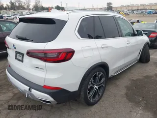 2021 BMW X5 sDrive40i with VIN 5UXCR4C0XM9F73416, listed as a IAAI auction lot 41722856 with 25,115 mi miles. Bid and sale history available at carsss.com. Image 4.