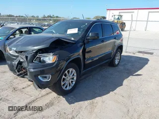 2014 Jeep Grand Cherokee Laredo with VIN 1C4RJEAG7EC263590, listed as a IAAI auction lot 41699106 with 136,581 mi miles and . Bid and sale history available at DreamBid. Image 19.