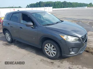 2014 Mazda CX-5 Touring with VIN JM3KE2CY3E0358604, listed as a IAAI auction lot 42600933 with 202,822 mi miles and . Bid and sale history available at DreamBid. Image 1.