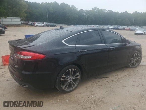 2019 Ford Fusion Titanium with VIN 3FA6P0K9XKR217324, listed as a Copart auction lot 56104185 with 135,728 mi miles and Salvage title. Bid and sale history available at DreamBid. Image 3.