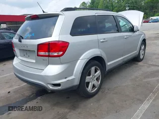 2012 Dodge Journey SXT z VIN 3C4PDCBGXCT324756, wystawiony jako IAAI lot #42422533 z przebiegiem 241 934 mil mil oraz . Historia ofert i sprzedaży dostępna na DreamBid. Obrazek 4.