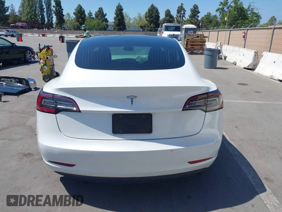2020 Tesla Model 3 Standard Range Plus with VIN 5YJ3E1EAXLF590591, listed as a IAAI auction lot 42140338 with 79,342 mi miles and . Bid and sale history available at DreamBid. Image 17.