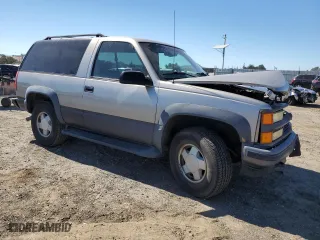 1999 Chevrolet Tahoe with VIN 3GNEK18R5XG184695, listed as a Copart auction lot 67697224 with 135,316 mi miles and Salvage Title. Bid and sale history available at carsss.com. Image 4.