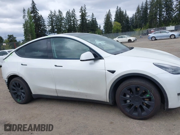 2021 Tesla Model Y Long Range with VIN 5YJYGDEE6MF082883, listed as a IAAI auction lot 42078807 with 64,953 mi miles. Bid and sale history available at carsss.com. Image 14.