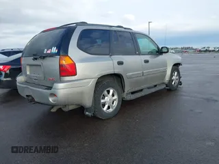 2003 GMC Envoy SLT with VIN 1GKDT13S532308502, listed as a IAAI auction lot 41676188 with 218,626 mi miles. Bid and sale history available at carsss.com. Image 4.