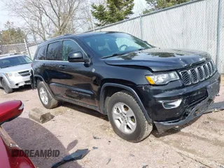 2017 Jeep Grand Cherokee Laredo with VIN 1C4RJFAGXHC863904, listed as a IAAI auction lot 41914465 with 122,981 mi miles. Bid and sale history available at carsss.com. Image 1.