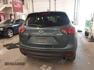 2016 Mazda CX-5 Touring z VIN JM3KE4CY2G0839202, wystawiony jako IAAI lot #41901207 z przebiegiem 65 449 mil mil oraz . Historia ofert i sprzedaży dostępna na DreamBid. Obrazek 17.