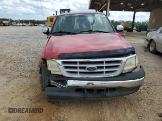 1999 Ford F-150 with VIN 1FTZX1725XNA33332, listed as a Copart auction lot 51867455 with 163,023 mi miles and Salvage title. Bid and sale history available at DreamBid. Image 5.