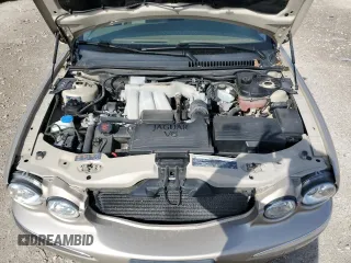 2004 Jaguar X-Type with VIN SAJEA51C64WD66013, listed as a Copart auction lot 50635615 with 47,365 mi miles and Salvage Title. Bid and sale history available at carsss.com. Image 11.